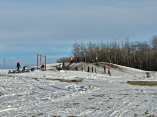 kids playing on snowy hill